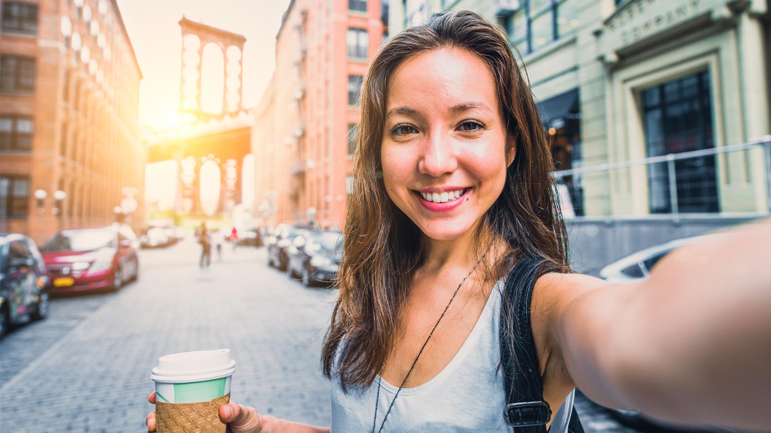 Use selfies as social media contest marketing Woman having a selfie with a coffee cup